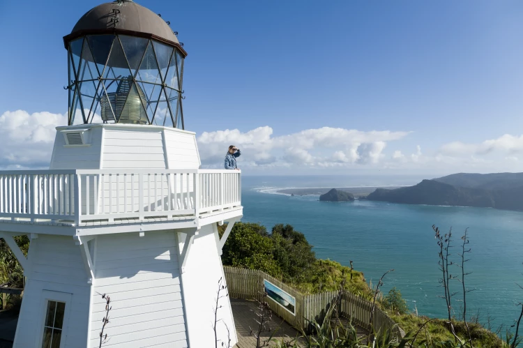 Girl looking out to the view at Awhitu Peninsula from the Manukau Heads lighthouse