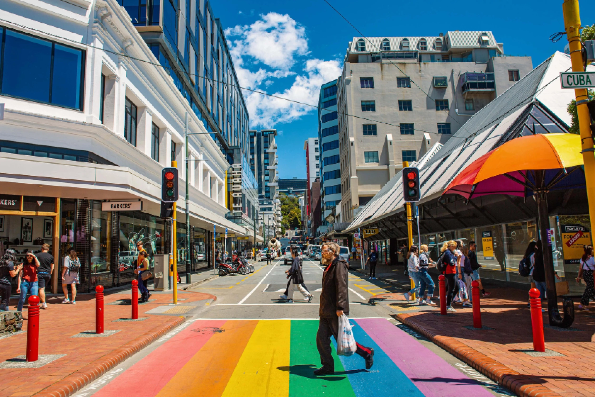 People walking the rainbow crossing at Cuba Street
