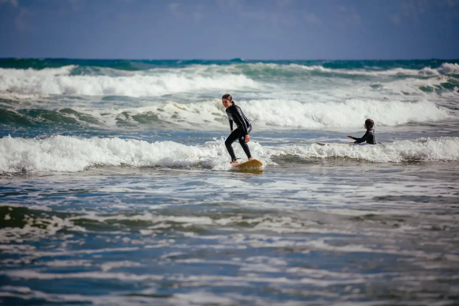 Surfing at Omamari/Ripiro Beach Northland