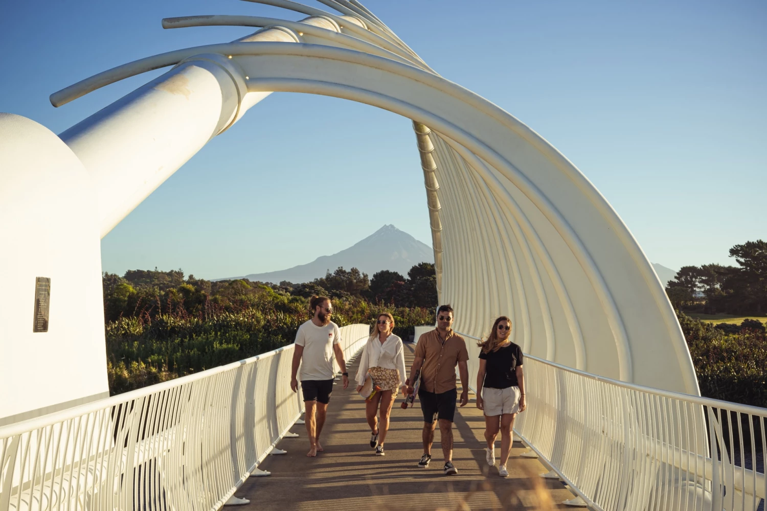 Te Rewa Rewa bridge with mountain group of friends | Credit: Taranaki Story