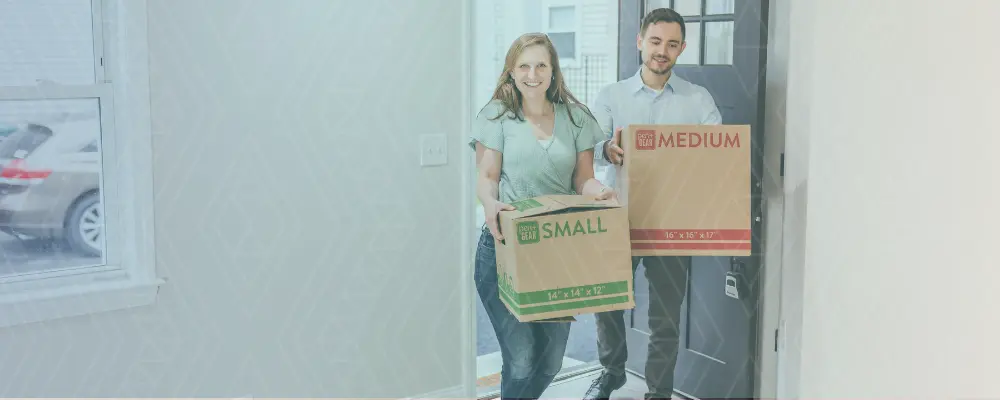 Couple with moving in boxes (popup banner)