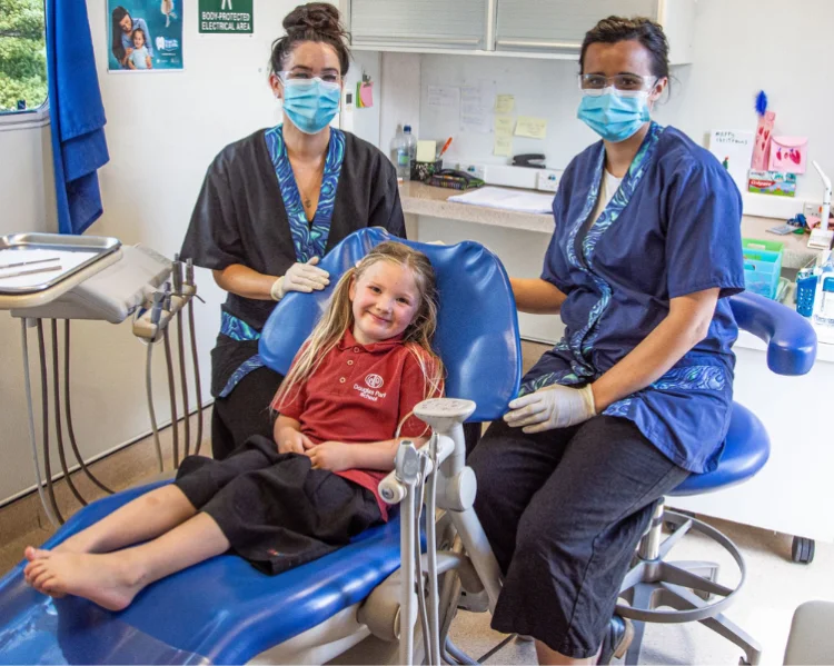 Two Oral Heatlh Therapists in New Zealand with a patient student