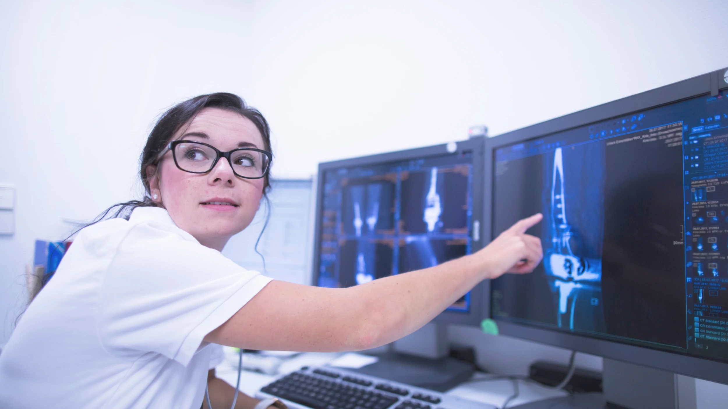 radiologist pointing to screen
