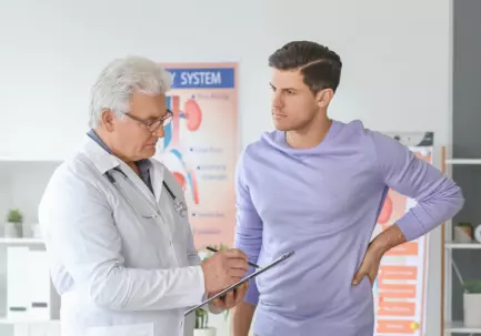 Urologist with patient (stock image)