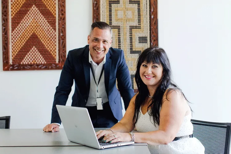 Two healthcare professionals looking at the camera smiling