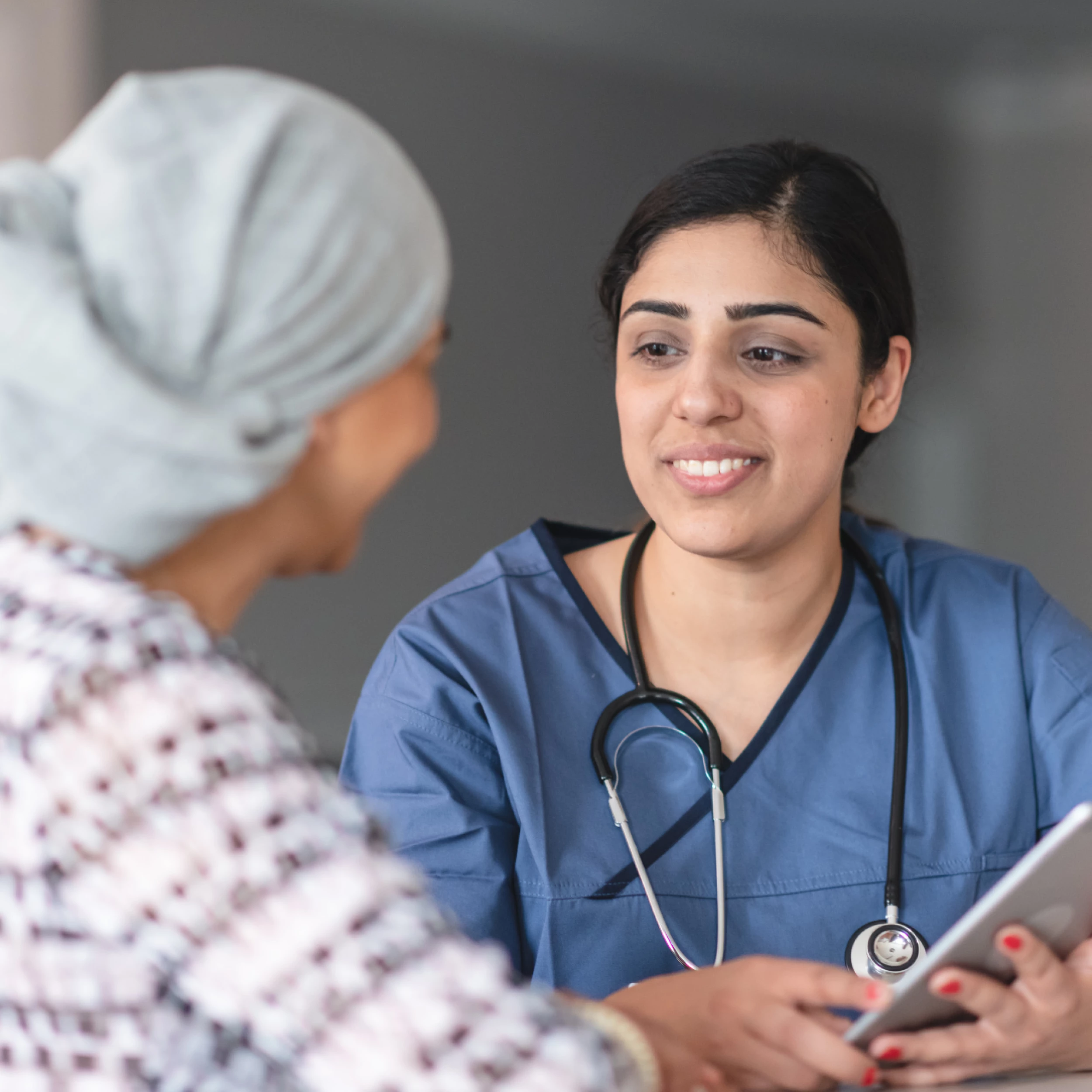Cancer doctor consulting with patient (stock image)
