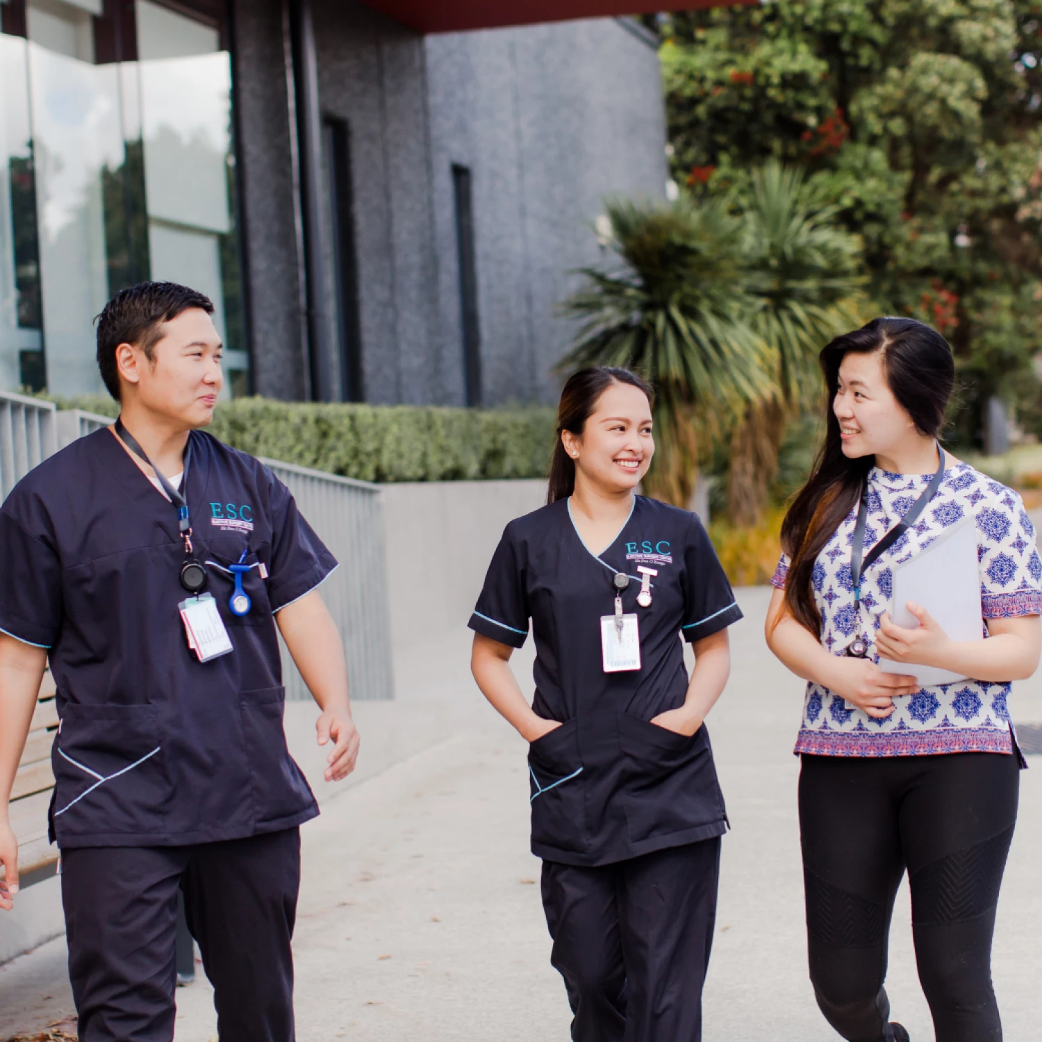 Elective Surgery Centre nurses on a stroll around smiling and having a friendly discussion