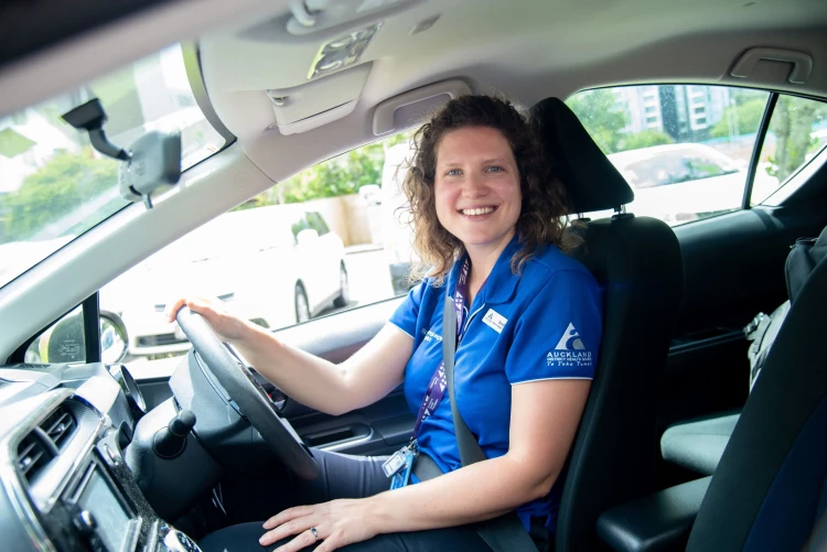 Speech Language Therapist Sarah in the driver's seat.